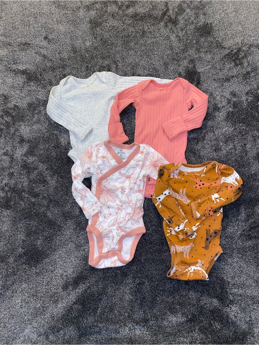 4-Pack Newborn Baby Girl Long Sleeve Onesies | Honest Baby & Carter’s